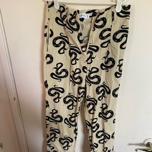Shekou pants with snakes on them
